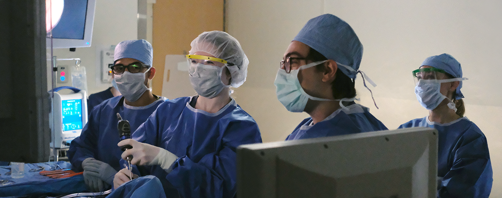 Residents performing a procedure