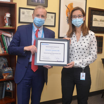 Dr. Quesnel receiving the Pollack Award